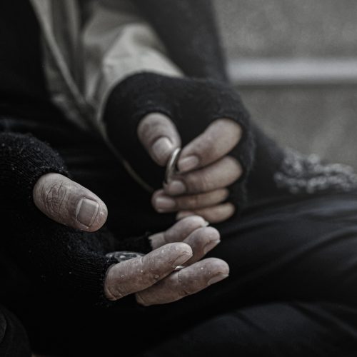 Close-up of the poor or homeless Homeless people ask for money in public.