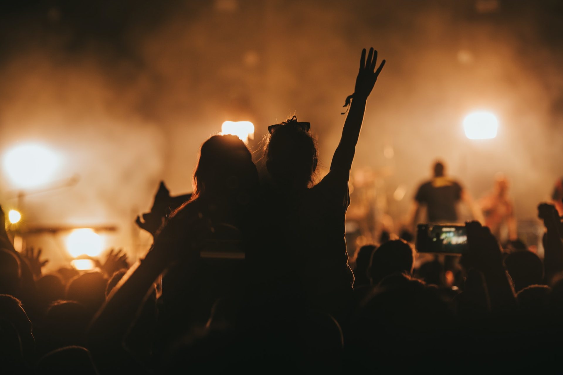 two-woman-in-the-crowd-at-a-music-festival.jpg